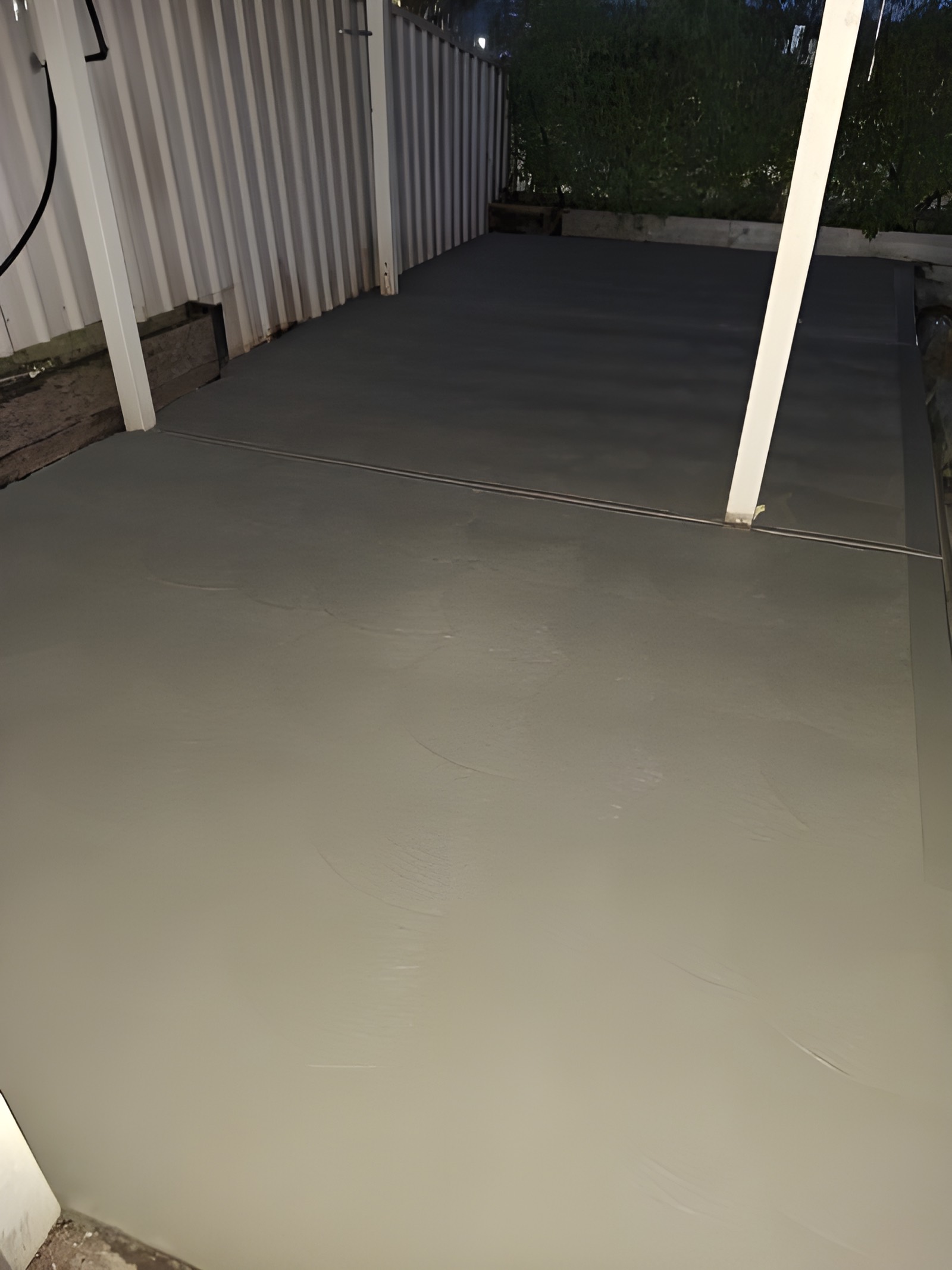 Fresh concrete verandah poured under a pergola